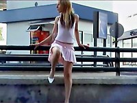 The hunter snapshots bestial blonde as her pink skirt goes up while she climbs the parapet!